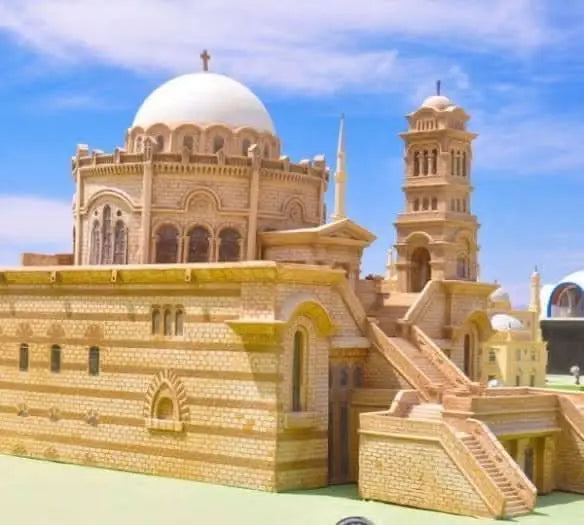 Sand City Museum model featuring a building with a dome, symbolizing mythological art in an open-air museum celebrating Egyptian creativity and historical legends.
