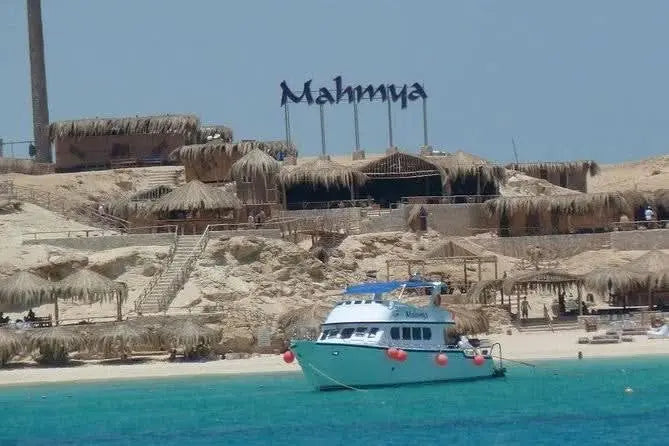 Boat on water, promoting the Full day snorkeling trip to Mahmya Island with lunch, showcasing a scenic snorkel trip in Hurghada's Red Sea.