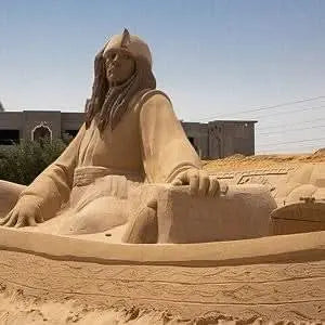 Sand City Museum sand sculpture depicting a man, showcasing mythological art in an open-air setting, highlighting Egyptian creativity and storytelling through detailed 3D statues.