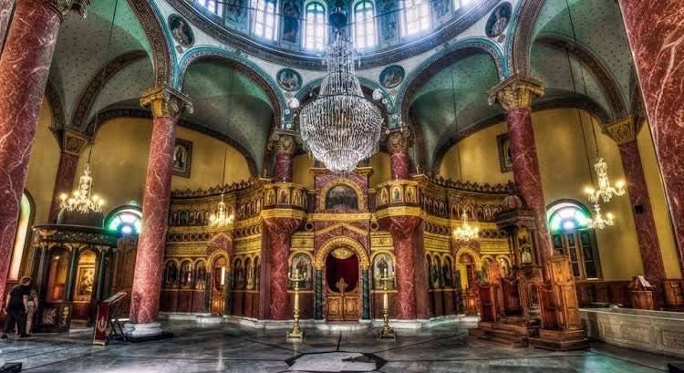 Ornate cathedral interior with chandeliers, reflecting the cultural richness of the Cultural tour to Cairo - 1 day exploring Egypt's historic sites.