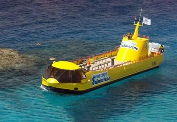 Royal Sea Scope - glass bottom boat on water, offering panoramic underwater views for family adventures, ideal for exploring the Red Sea's marine life.