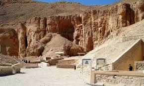Luxor day tour with overnight stay, featuring majestic desert rock formations and ancient ruins, offering an immersive experience in Egypt's historical and natural landscapes.