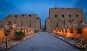 Stone building with statues, representing the day tour to Luxor incl. overnight stay, highlighting iconic sites like Karnak Temple and Nile views.