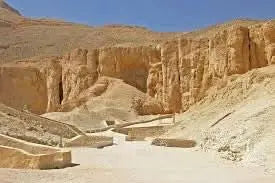 Luxor day tour image showing a large desert rock formation with a staircase, representing the ancient landscapes explored on the day tour to Luxor incl. overnight stay.