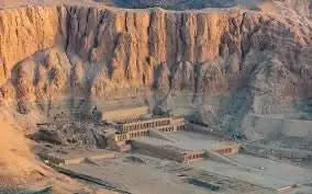 Day trip to Luxor product showing an ancient Egyptian temple carved into a rocky cliff, highlighting historical exploration and cultural immersion experiences.