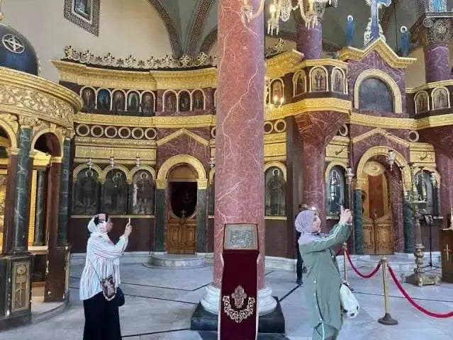 Cultural tour to Cairo - 1 day: Image of tourists capturing a building, reflecting the immersive experience of visiting Cairo's historic sites and cultural landmarks.