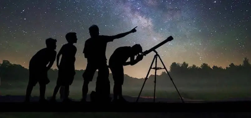 Silhouettes gaze through a telescope, capturing the essence of the jeep safari with stargazing adventure, blending desert exploration with stargazing experiences.