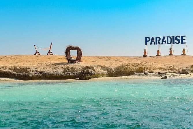 Paradise Island adventure with private speedboat and snorkeling, featuring a sandy beach and azure waters, offering a unique experience of relaxation and exploration.