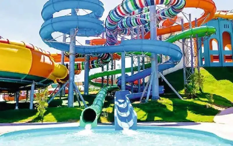 Jaz Makadi Aquaviva Waterworld with colorful slides and pools, showcasing thrilling attractions for all ages at this expansive water-themed park in Hurghada.