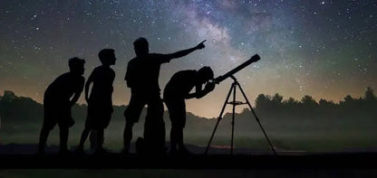 Silhouettes gaze through a telescope, capturing the essence of the jeep safari with stargazing adventure, blending desert exploration with stargazing experiences.